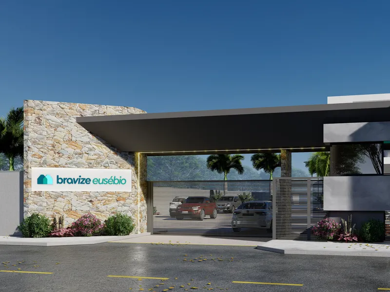 Guarita do Bravize Eusébio, com o letreiro do empreendimento sobre a parede de pedra e o portão de acesso