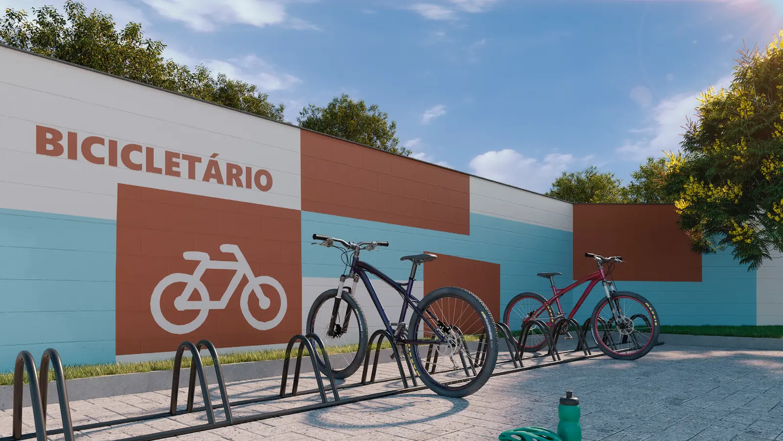 Bicicletário do Hype Condomínio Clube, com suportes e bicicletas junto à parede sinalizada
