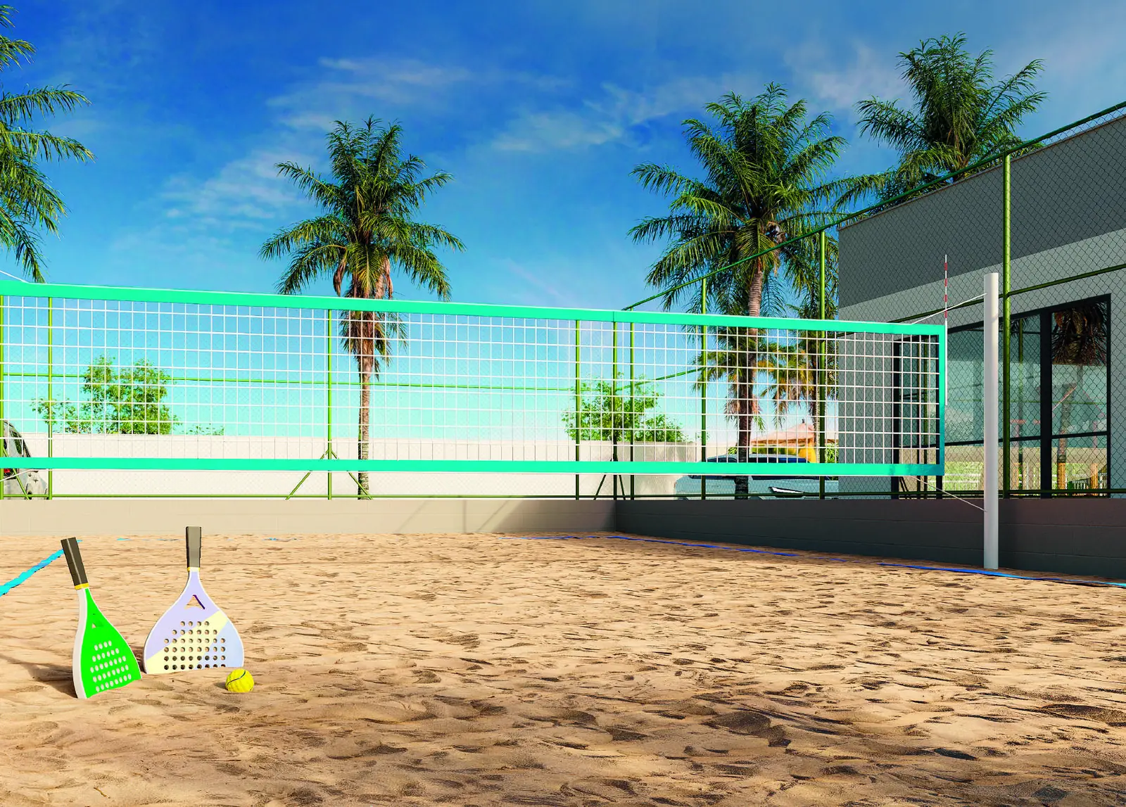 Quadra de beach tennis do Jóquei Condomínio Clube, com areia, rede e as torres ao fundo