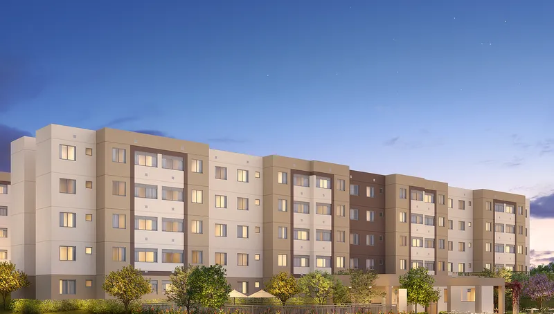 Fachada de um dos blocos do Laguna Ville, de térreo mais quatro pavimentos, com paisagismo à frente