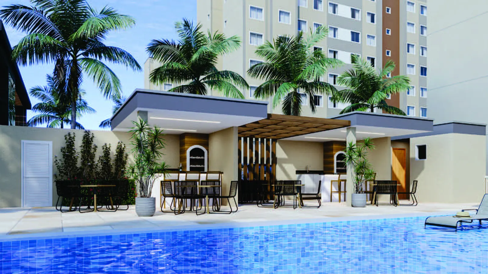 Quiosque com churrasqueiras do Stay One, coberto, com mesas e cadeiras à beira da piscina