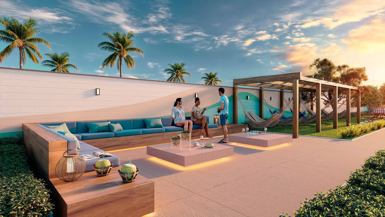 Espaço relax do Vista Coqueiral, com sofás baixos, pergolado e vista para o mar ao entardecer