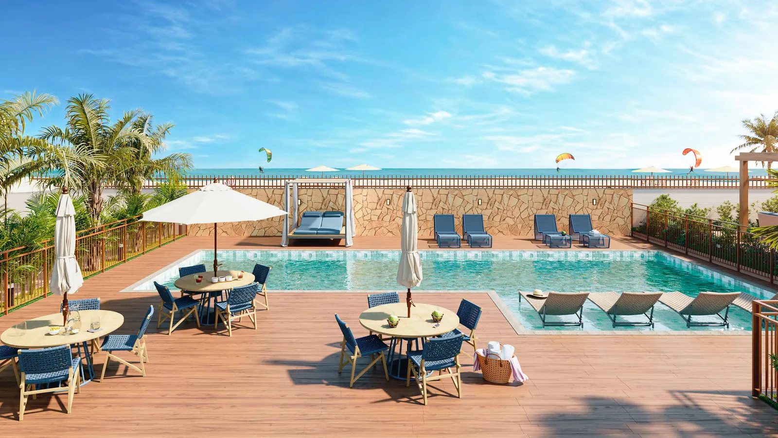 Piscina do Vista Coqueiral, com deck, espreguiçadeiras, guarda-sóis e as torres ao fundo