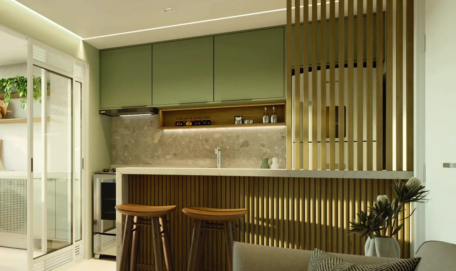 Cozinha decorada do Vista di Mari Prime, com bancada, armários e área de serviço ao lado