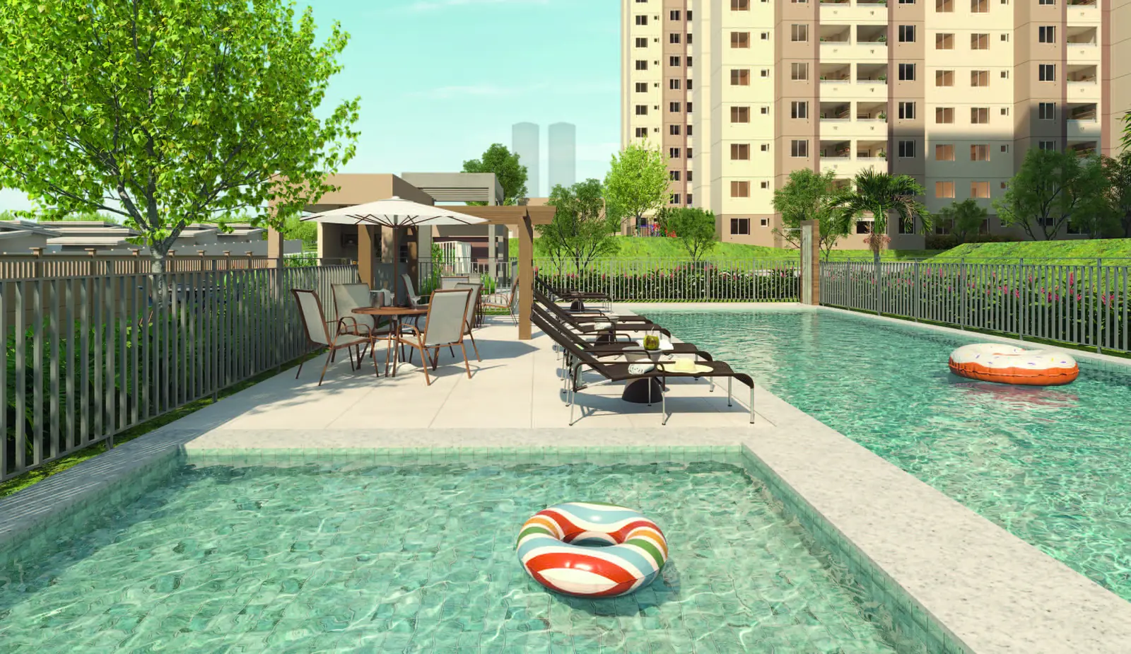 Piscina infantil do Vista di Mari Prime, com lâmina rasa ao lado da piscina adulto e as torres ao fundo
