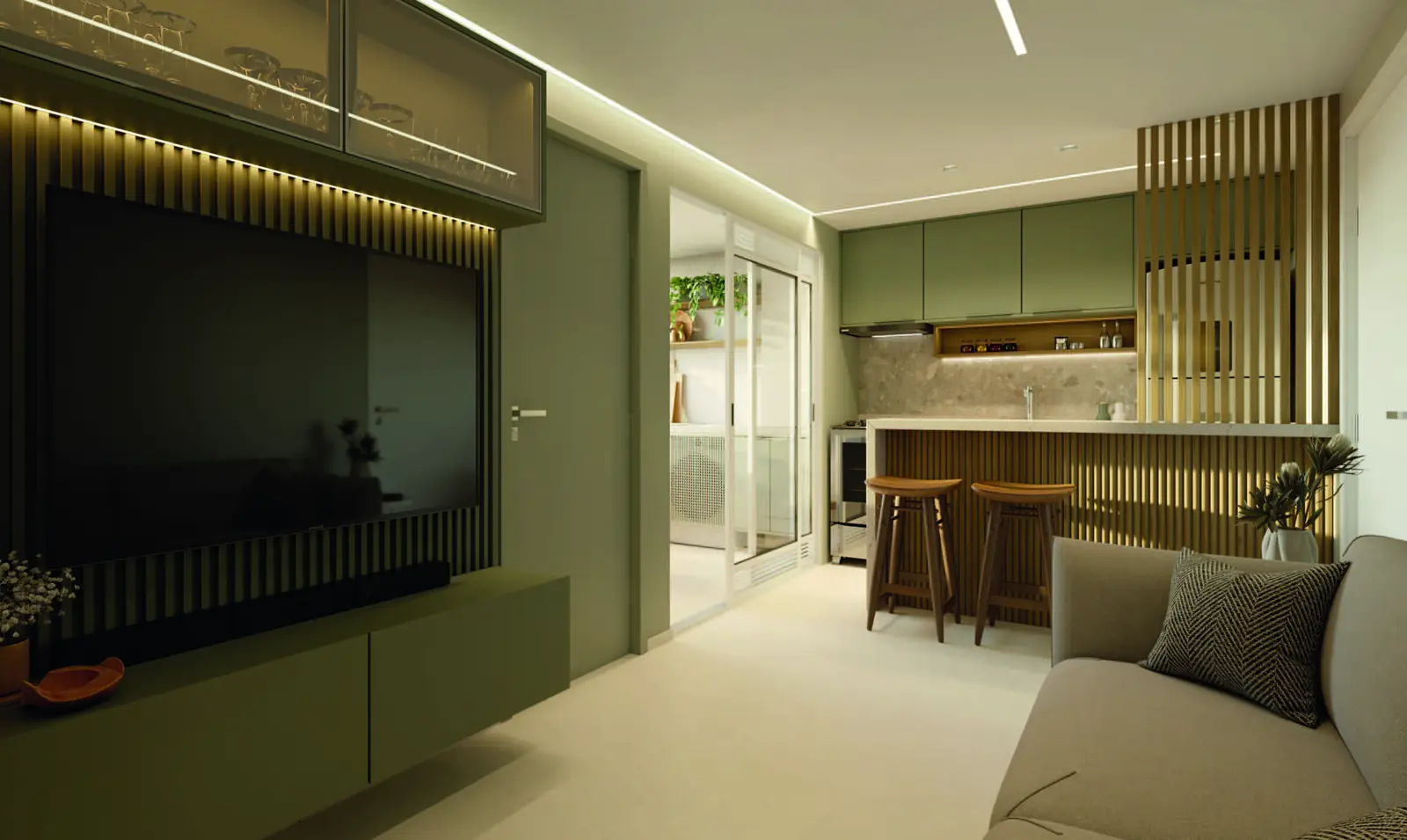 Sala de estar e jantar decorada de um apartamento do Vista di Mari Prime, com painel de televisão e cozinha integrada ao fundo