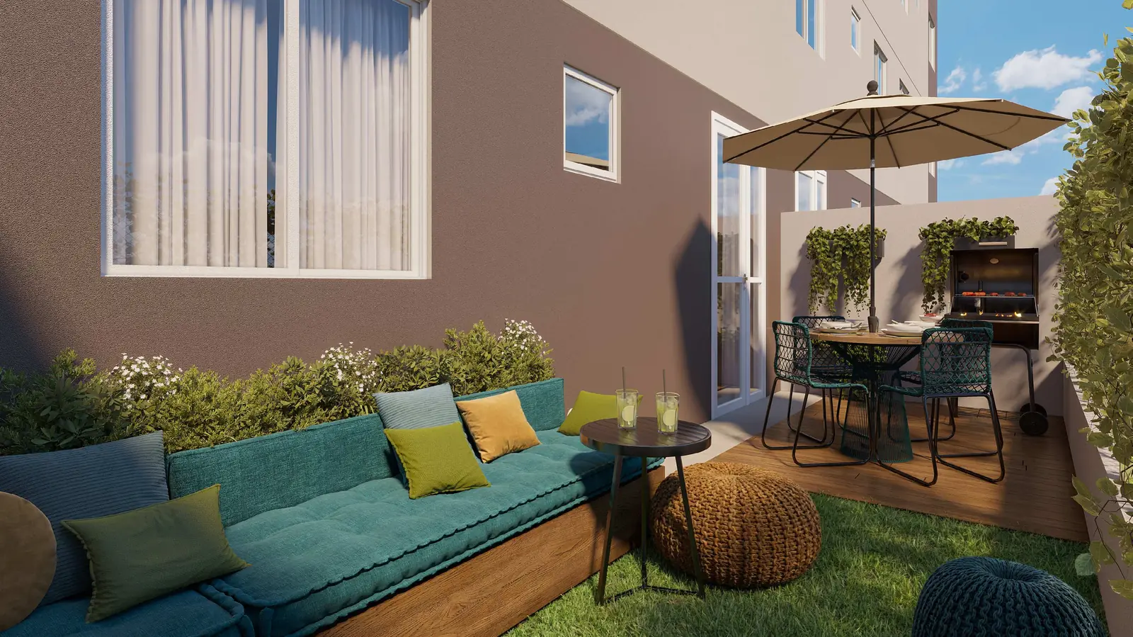 Jardim privativo de um apartamento térreo do Vitória Íris, com sofá externo, mesa e vegetação